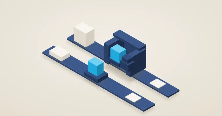 Two navy workstations run identical cyan modules and turn out the same finished card, but the bulkier station draws on a far taller stack of paper.