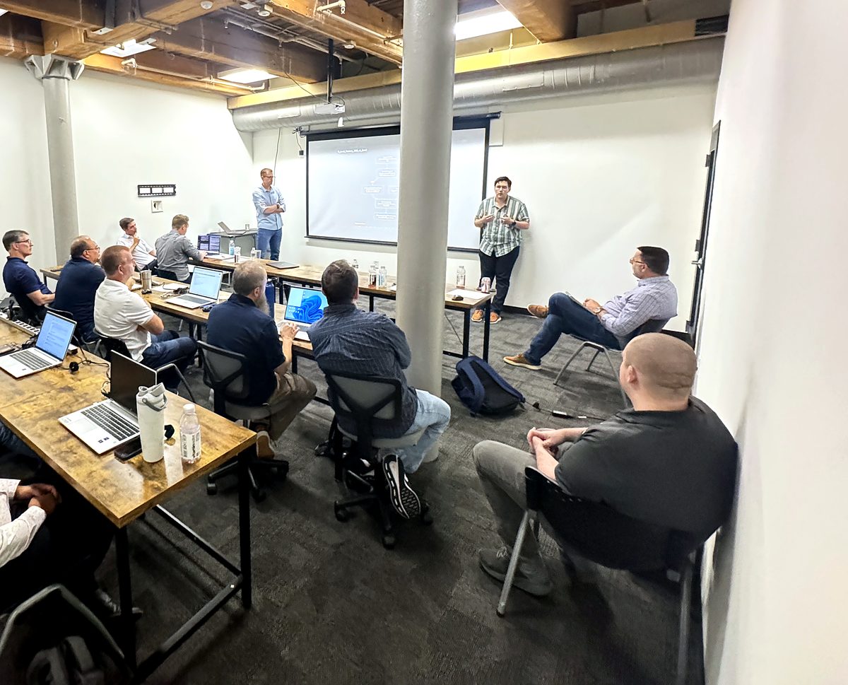 CoMavenAI engineers presenting in a working session