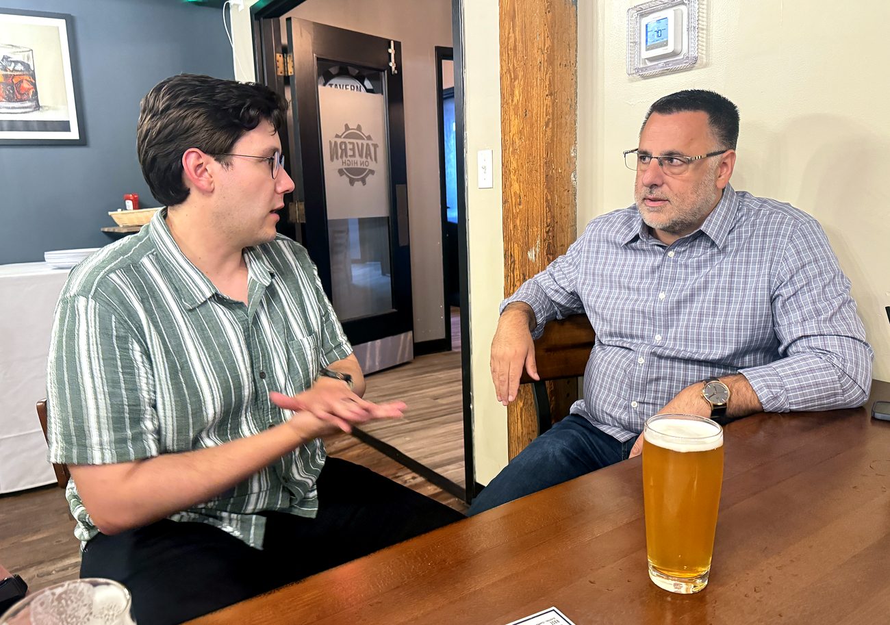 Two CoMavenAI team members talking